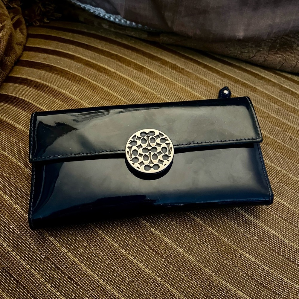Elegant Black Clutch Coach wallet with Silver Accent